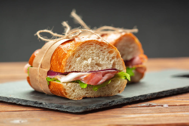 close up of sandwich on wooden table - 写真・画像