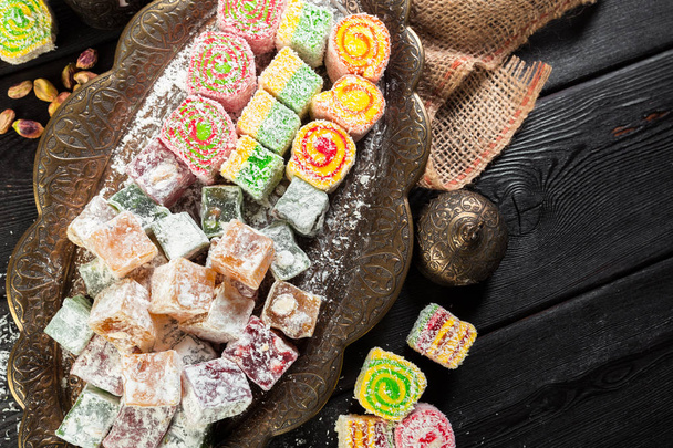 plate with turkish sweets on wooden table - 写真・画像