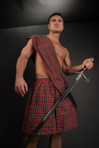 The sexy highlander poses for the camera. - Photo, Image