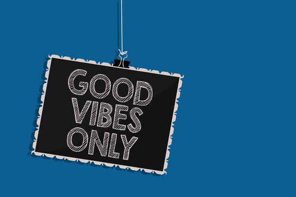 Writing note showing Good Vibes Only. Business photo showcasing Just positive emotions feelings No negative energies Hanging blackboard message communication information blue background - Photo, Image