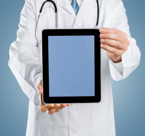 Doctor using digital tablet, close-up view  - Фото, изображение