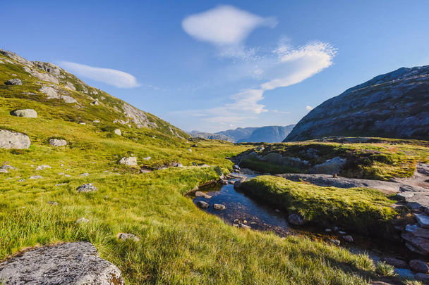 Landscape travel on the way to  the stone of the kjerag in the mountains kjeragbolten of Norway nature, mountains , the feeling of complete freedom on sunset - Fotó, kép