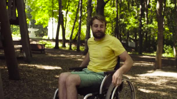 Young disable man with his wife on a walk in the park - Footage, Video