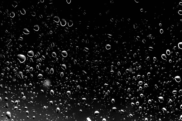 Raindrops on black glass, wet glass texture - Photo, Image