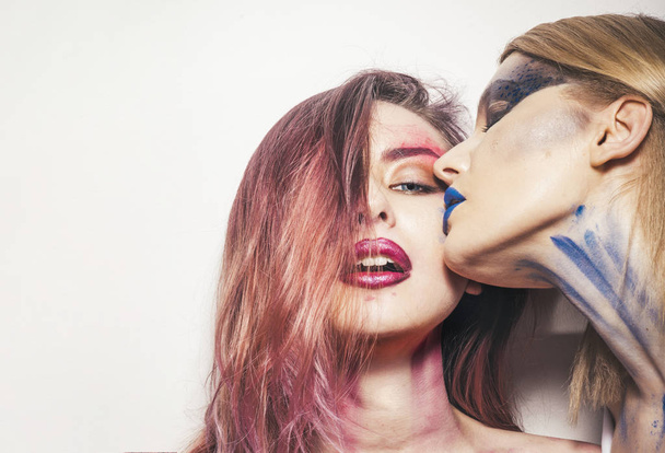 Makeup concept. Women with makeup and body art. Women with sensual kiss on makeup face. We makeup your face - Photo, image