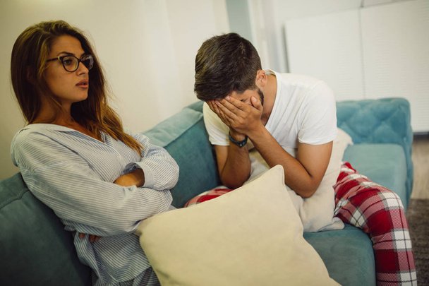 Portrait of young woman and man at home having relationship problems - Photo, Image