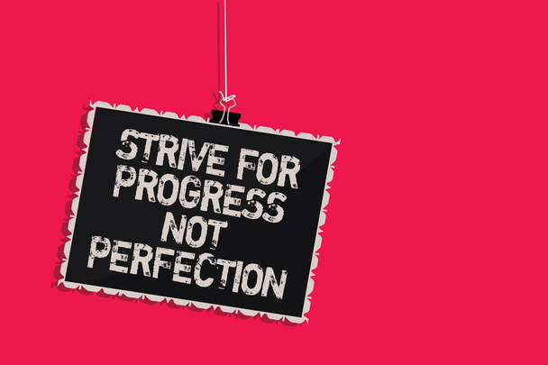 Word writing text Strive For Progress Not Perfection. Business concept for Improve with flexibility Advance Grow Hanging blackboard message communication information sign pink background - Photo, Image