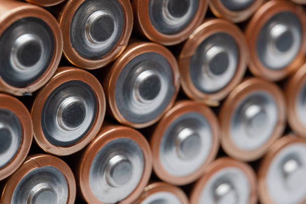Rows of batteries stacked on top of each other. Up close macro shot. - Photo, Image