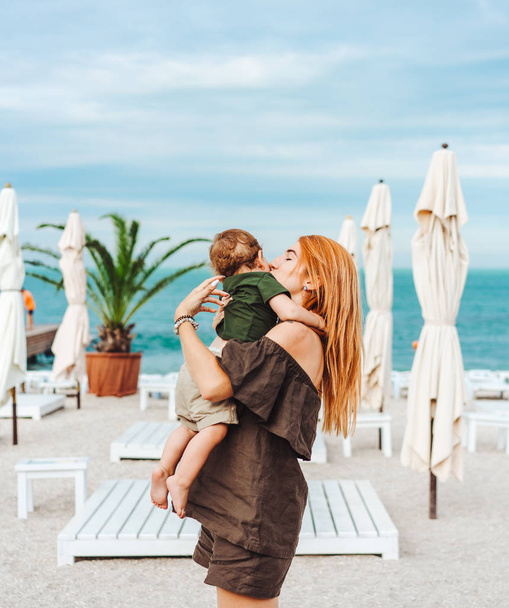 Mom and her little son on the beach, on vacation - Photo, Image