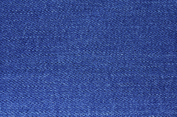 blue texture maden from a piece of jeans blurred toned - Foto, Imagem