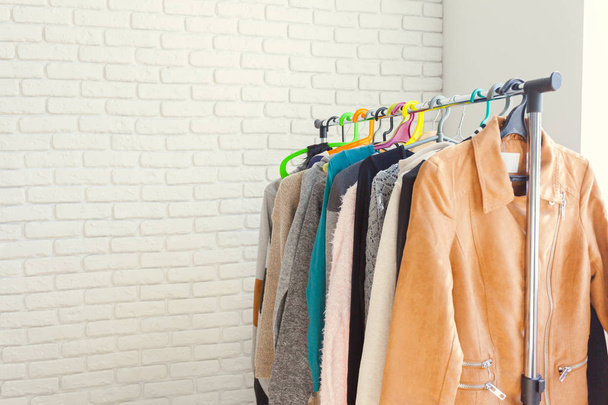 Clothing rack standing indoor - Фото, изображение