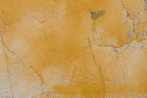 Wall fragment with scratches and cracks. It can be used as a background - Фото, зображення