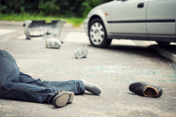 Victim of traffic incident hit by car on the street - Valokuva, kuva