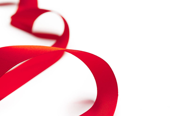 Red ribbon on white background - Foto, afbeelding