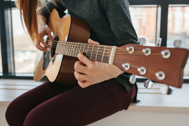Learning to play the guitar. Music education and extracurricular lessons - Photo, Image