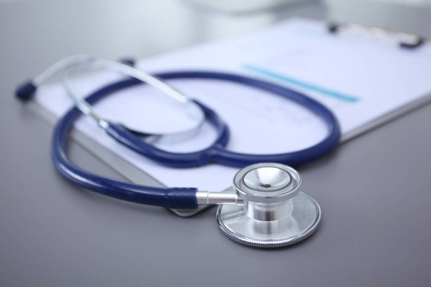Medical equipment: blue stethoscope and tablet on white background. Medical equipment - Fotoğraf, Görsel