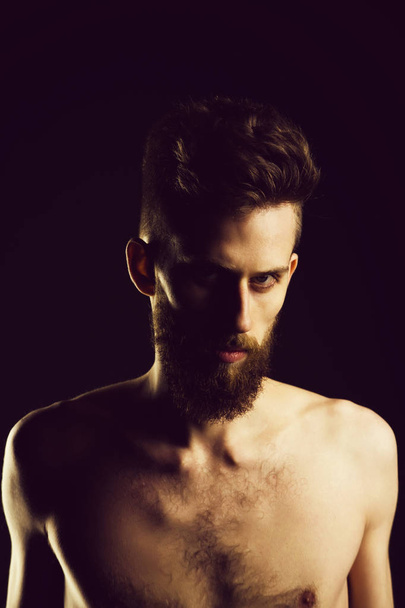 bearded hipster young man has serious face and bare chest - Valokuva, kuva