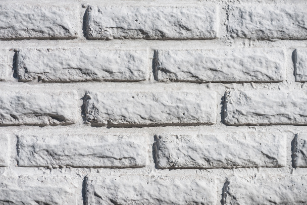 close-up view of white aged brick wall background  - Fotografie, Obrázek