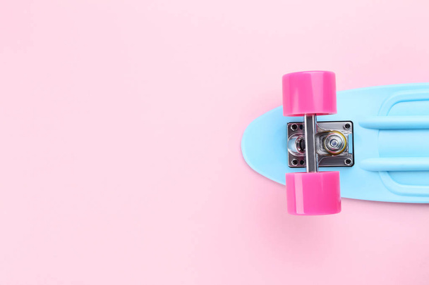 Skateboard on pink background - Фото, изображение