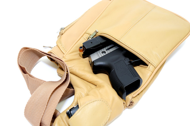 pénztárca és kézifegyver - Fotó, kép