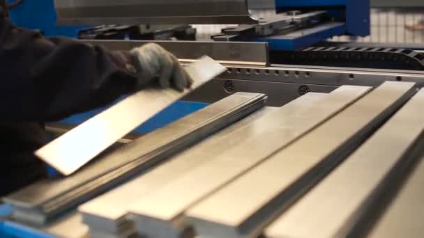 Man working with sheet metal and special machine tools for bending. Scene. Modern machines can accurately perform tasks - Footage, Video