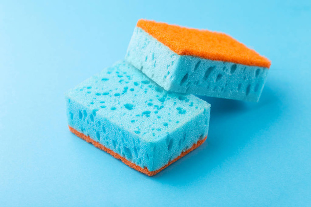 Sponges for dishwashing. Kitchen equipment. Blue background. Studio - Photo, Image