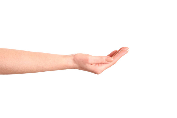Die Handbewegung öffnet sich, als würde man etwas auf der Handfläche halten, isoliert auf weißem Hintergrund. Schneidpfad. - Foto, Bild