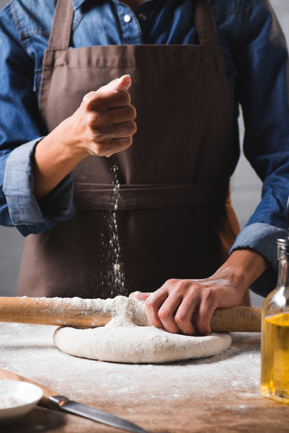 partial view of woman kneading dough for pizza - Photo, Image