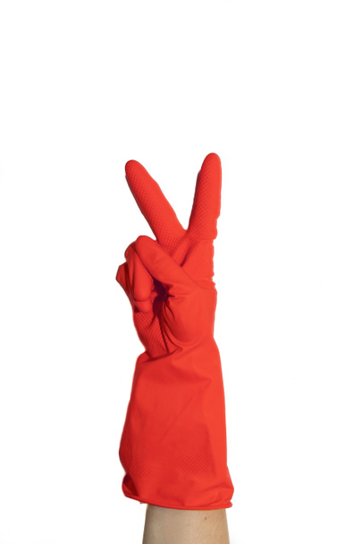 Rubber gloves for cleaning. Preparing for cleaning. Hands clean after cleaning. Squeaky people. Wash floors, wash dishes. Rubber gloves on the hand. Rubber gloves on a hand on a white background. - Photo, Image