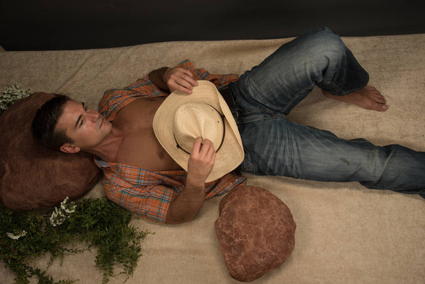 The sexy rancher poses for the camera.  - Photo, Image