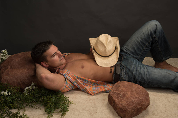 The sexy rancher poses for the camera.  - Photo, Image