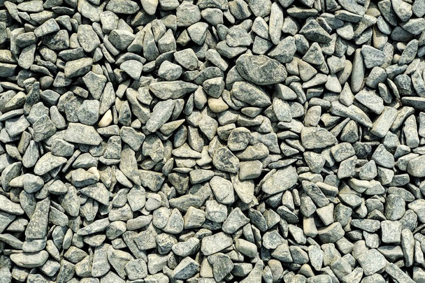 Gris grava. La textura de una piedra gris. Césped
 - Foto, imagen