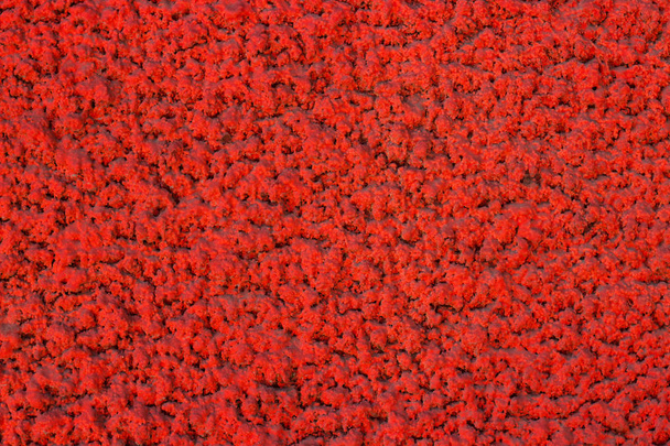 Czerwony teksturowanej trójwymiarowy wzór putty na ścianie - Zdjęcie, obraz