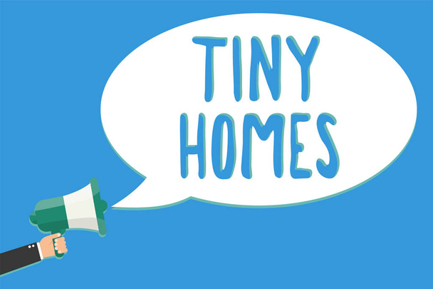 Text sign showing Tiny Homes. Conceptual photo houses contain one room only or two and small entrance Cheap Man holding megaphone loudspeaker speech bubble message speaking loud - Photo, Image