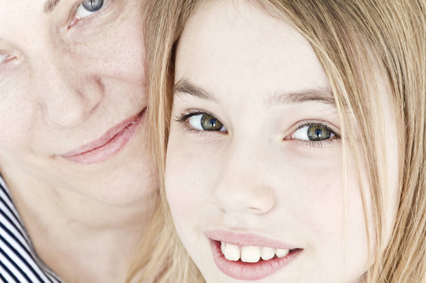 Close portrait of beautiful happiest mother and daughter - Foto, immagini