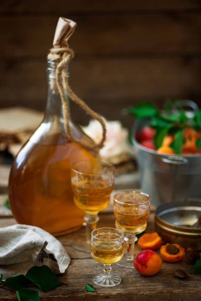 Apricot liqueur in the glasses .style vintage. selective focus - Фото, изображение