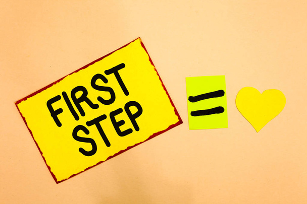Conceptual hand writing showing First Step. Business photo text Pertaining to the start of a certain process or beginning Yellow paper reminder equal sign heart sending romantic feelings - Photo, Image