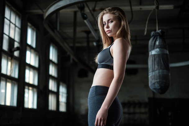 Female Boxer preparing for training in Boxing Club - Photo, Image