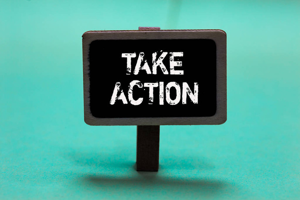 Text sign showing Take Action. Conceptual photo advices someone to do something or reaction right now Blackboard green background important message ideas communicate reflections - Photo, Image
