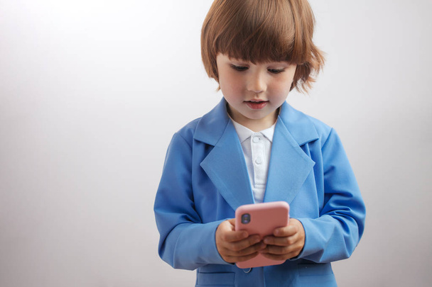intelligent boy is texting message, playing ponline games., sending pictures - Fotoğraf, Görsel