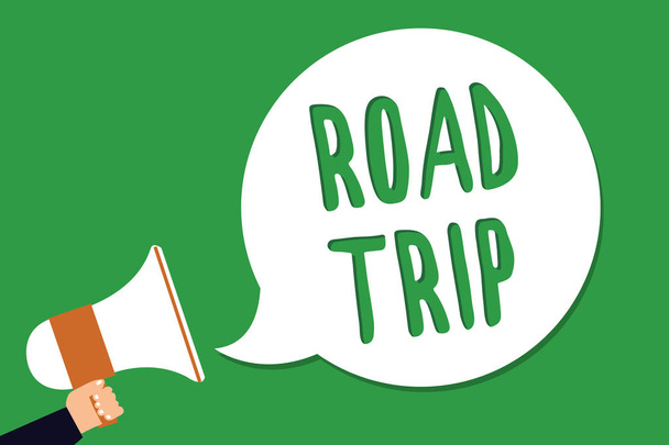 Conceptual hand writing showing Road Trip. Business photo showcasing Roaming around places with no definite or exact target location Man holding megaphone loudspeaker screaming green background - Photo, Image