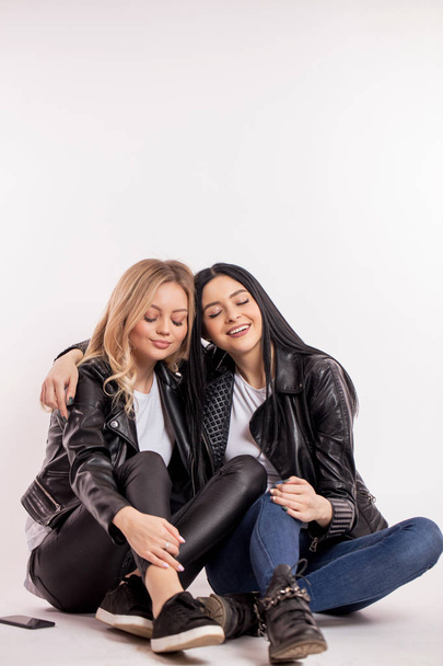 two gorgeous stylish women appreciate their friendship - Фото, зображення