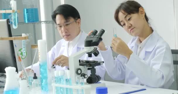 Team of scientist working in a secure high level research laboratory. - Felvétel, videó