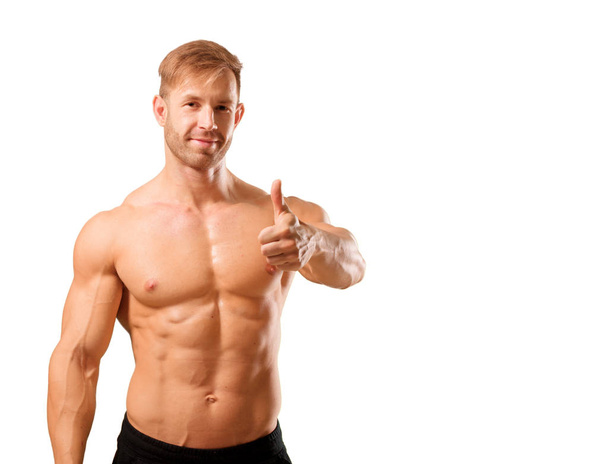young handsome bodybuilder man posing with muscular appearance - Valokuva, kuva