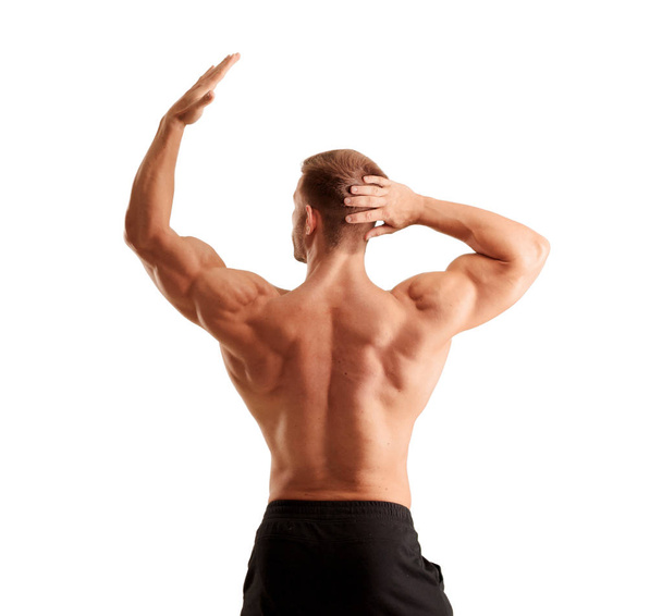 young handsome bodybuilder man posing with muscular appearance - Φωτογραφία, εικόνα