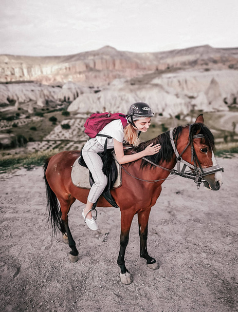 Young girl horse riding in Cappadocia. Goreme. - Fotoğraf, Görsel