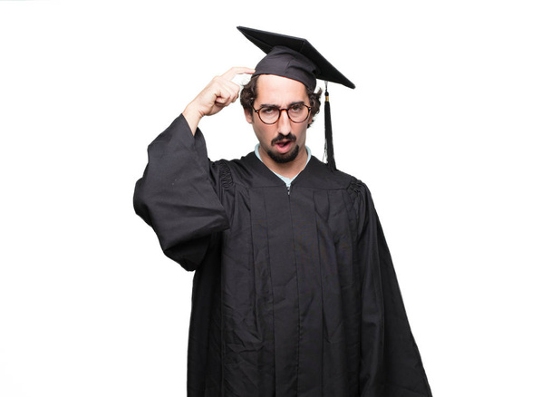 graduate bearded man with a goofy, dumb, silly look, feeling shocked and confused at a recent realization, not really understanding an idea. - Photo, image