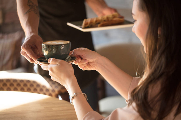 close up cropped photo of brown-haired lady having coffee - 写真・画像