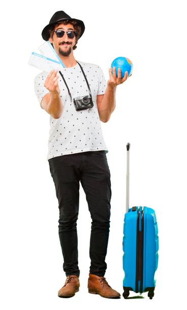 Young bearded cool traveller man with a bag. Holidays concept. - Photo, image