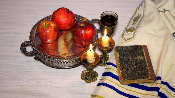 Jewish holiday shofar, torah book, honey, apple and pomegranate rosh hashanah traditional holiday symbols. - Photo, Image